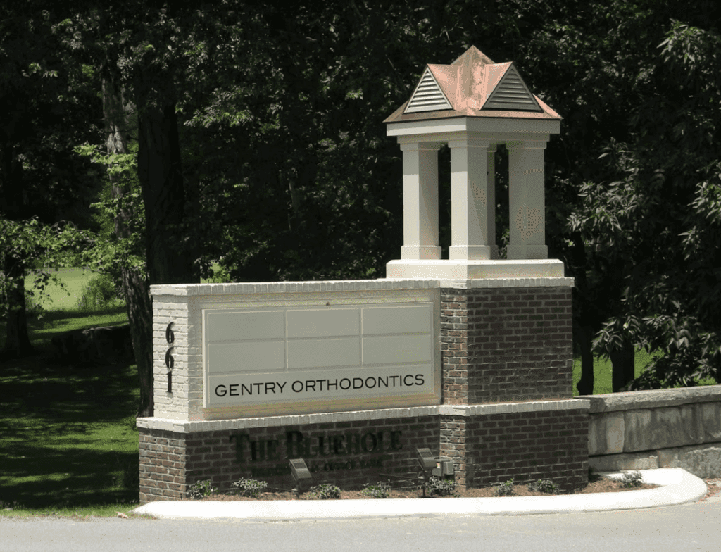 A photo of the street view of the Gentry Orthodontics sign.