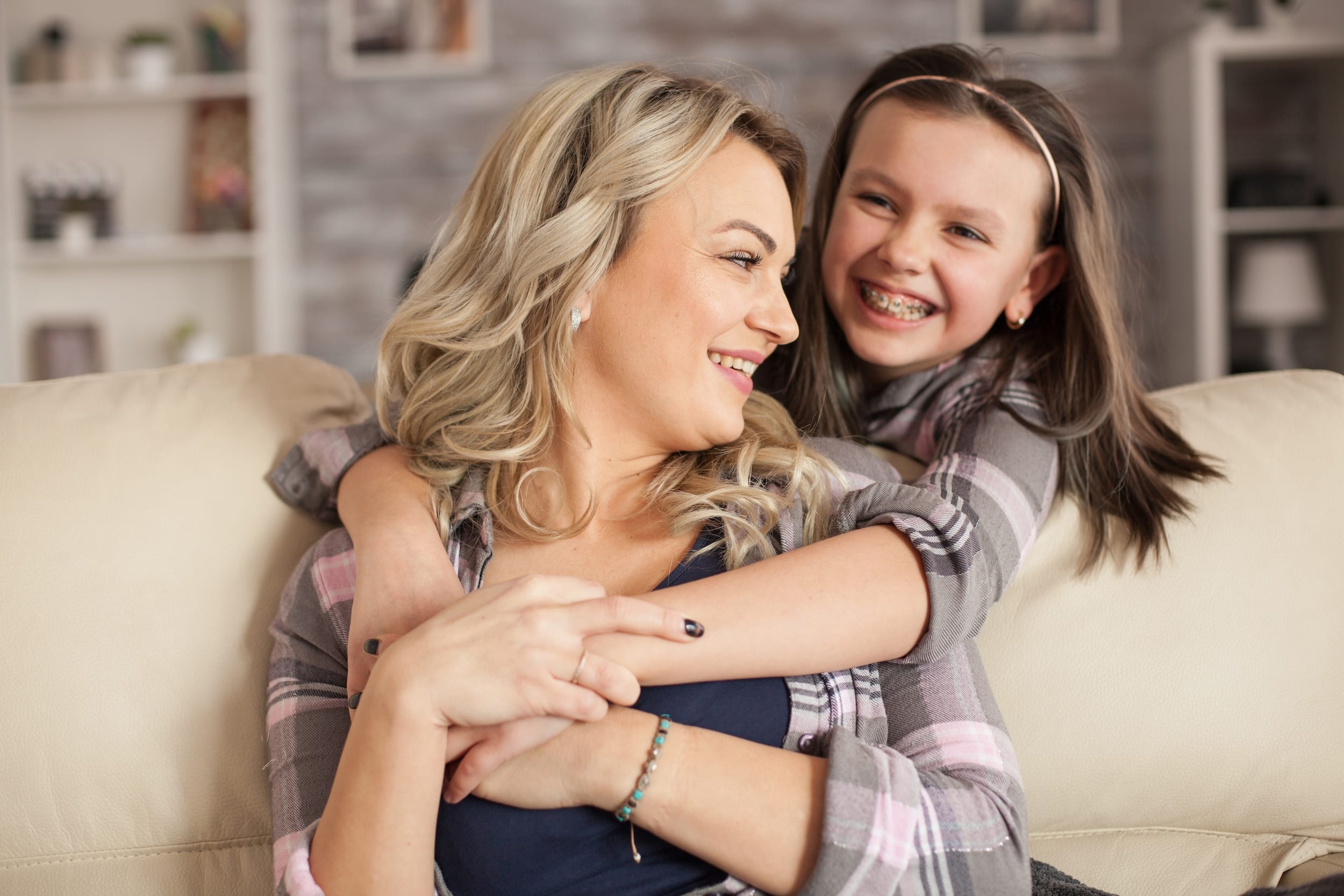 girl with braces with mom