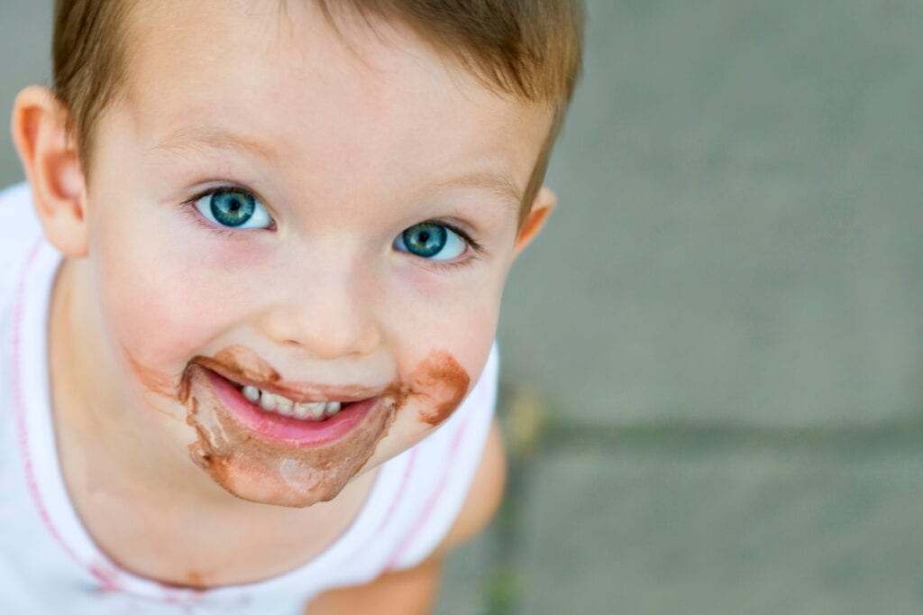 braces patient with chocolate on face